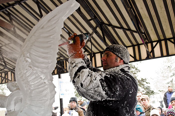 Derek Maxfield, co-owner of Grand Rapids' Ice Sculptures Ltd., getting frosty during Rockford Ice Festival 2012.