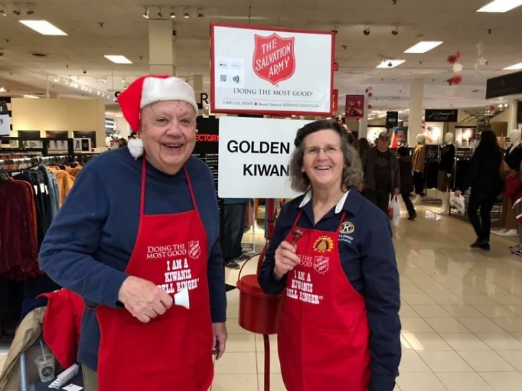 Judd Ross and Club President Gloria Canglegosi from the Golden "K" Kiwanis Club ring bells at Woodland Mall on Black Friday.