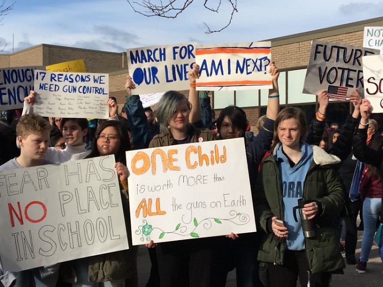 City students hold signs for school safety