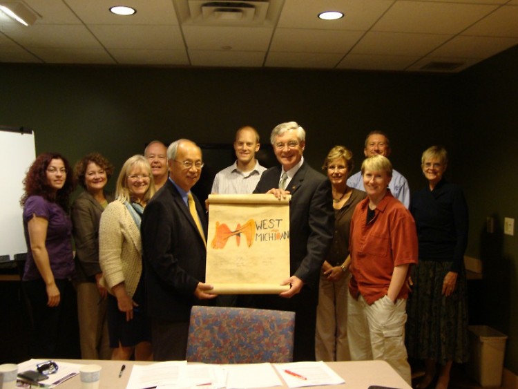 Members of the Community Literacy Initiative advisory council sign the Right to Literacy Scroll.