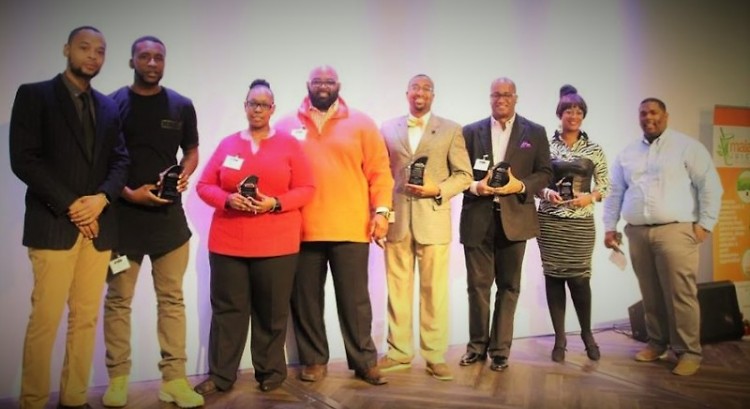 Jamiel Robinson, shown on far right with last year's GRABB award winners, is the organizer behind the #TheShift Summit.