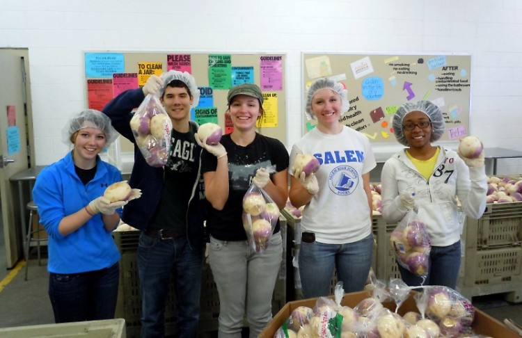 Students from Grand Valley State University bagged turnips for families in need.