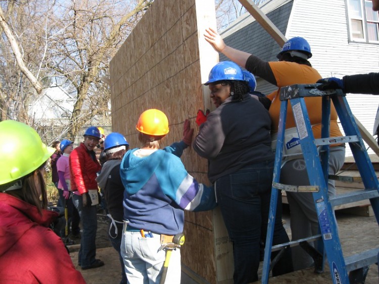 Volunteers from Habitat for Humanity of Kent County participate in wall-raising ceremony