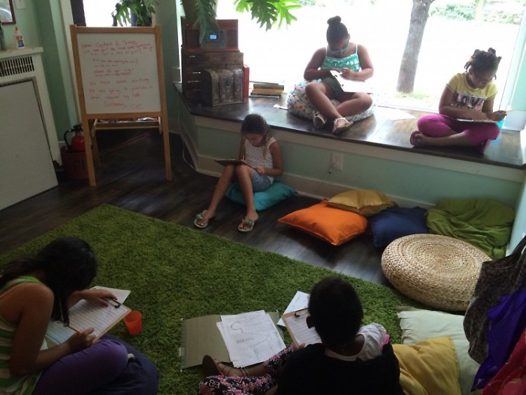 Young writers fill their notebooks with musings at the Grand Rapids Creative Youth Center