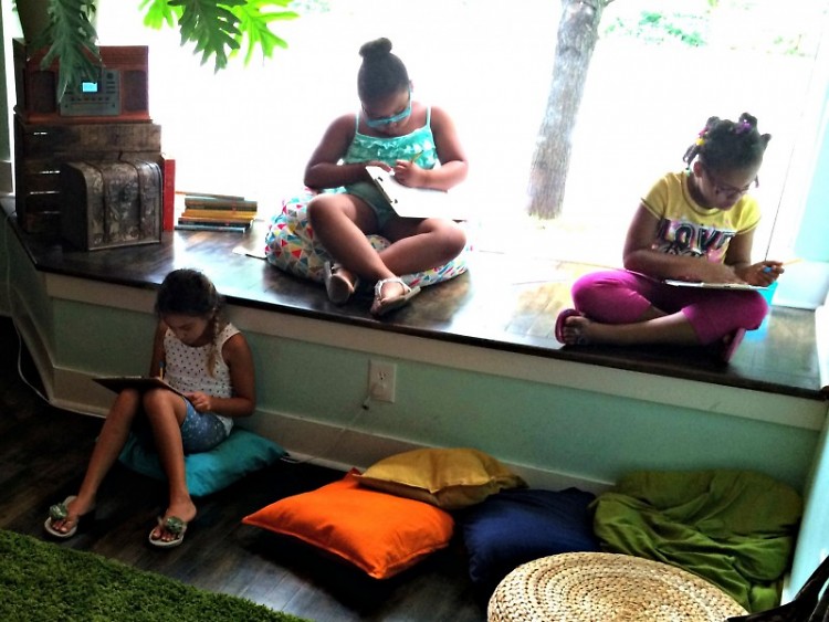 Children reading at the Creative Youth Center
