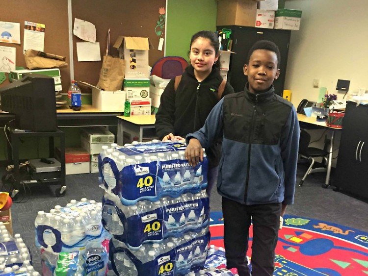 Students at Harrison Park collecting water for Flint