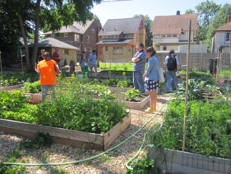 Lisa Oliver King leads a group on an East Town Garden Tour.