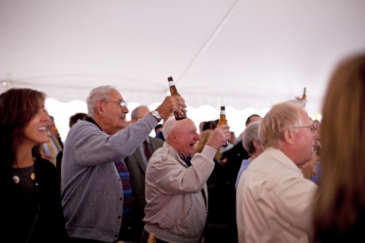 The crowd toasts to the new development 
