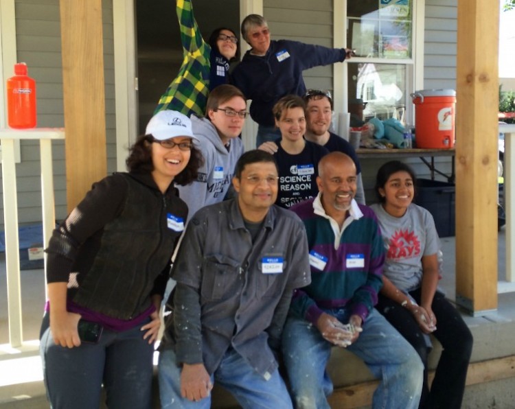 Interfaith community working together on a Habitat for Humanity project