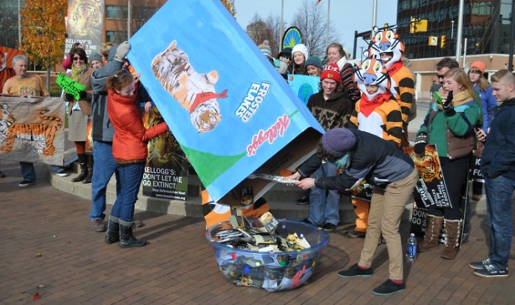 Forest Heroes volunteers dump over 5,000 petitions from across Michigan into a cereal bowl to deliver to key Kellogg's employees