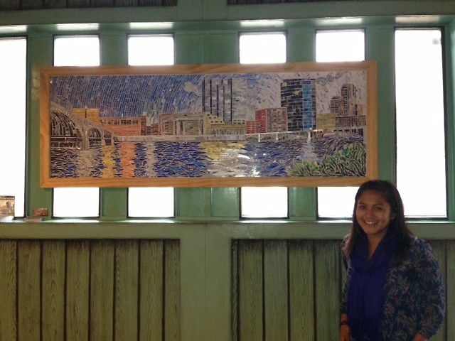 Jessica Vitale beside her piece, "Land of Opportunity".
