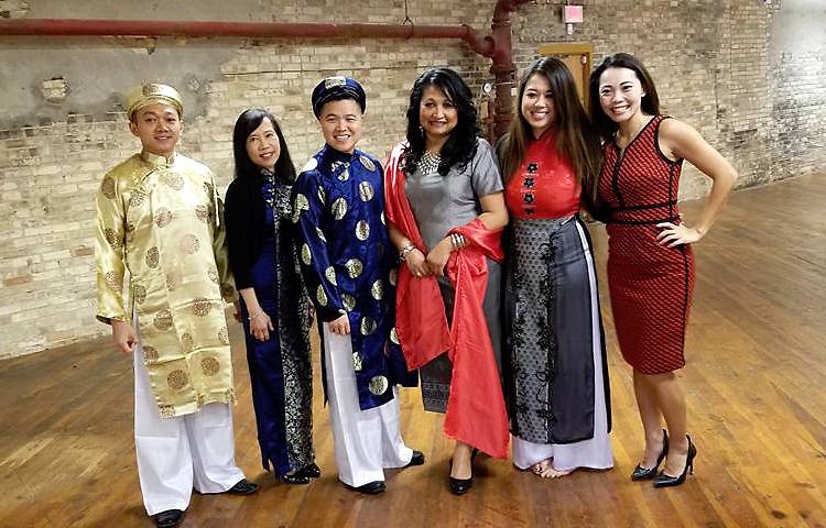 Members of the local Asian community in traditional dress