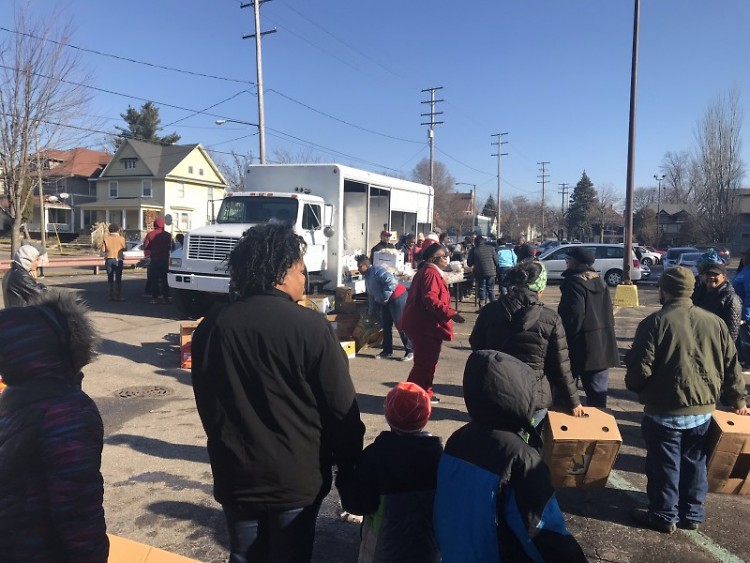 Neighbors wait in line to receive food at a January Mobile Food Pantry.