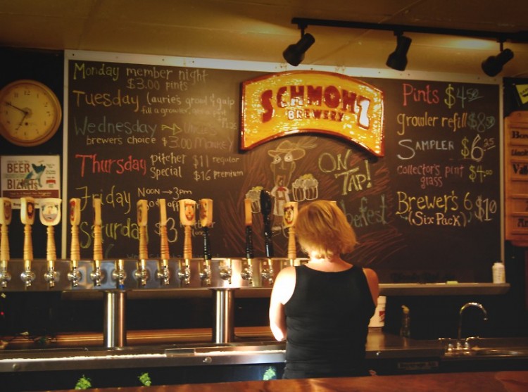 Laurie Schwerin serves up a beer at Schmohz Brewery