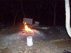 Picture of campfire at the homeless encampment. This is located in the middle of the city.