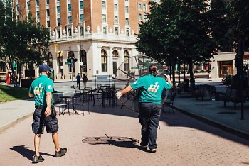 Grand Rapids' Downtown Ambassadors installed tables and chairs for its downtown social zones on Friday.