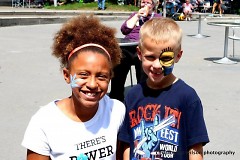 Children having fun with free face painting at GRandJazzFest