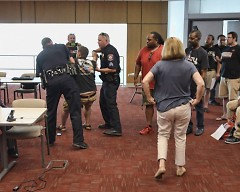 Louis DeShane is being arrested at the August 30,  2017 Rapid Board meeting 