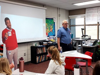 State Farm volunteer delivering JA programs in a local classroom
