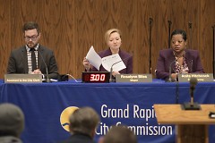 Grand Rapids Mayor Rosalynn Bliss looking over the meeting agenda 