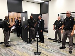 Kent County Sheriff officers at the door of the Kent County Commission meeting