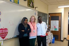 Amina Abdullahi and Abdelsalam Yaya with their teacher Erika Curtiss, who works with refugee and immigrant students.