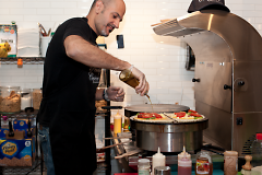 Andreas Papangelopoulos prepares two savory crepes