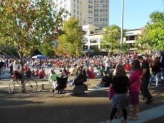 A large crowd of concert goers enjoying the last concert of the summer at Rosa Park Circle in Grand Rapids, Michigan 