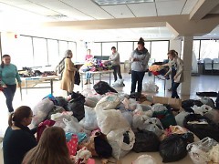 Volunteers sorting donations for refugees at Masjid AT-Tawheed