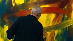 Gerard Richter paints on a canvas