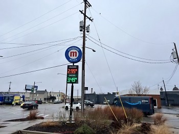 Rainy day at Stockbridge Meijer gas station — unleaded at $2.99 and diesel at $3.49.