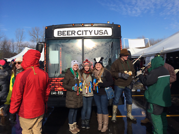McKenna Jaekel, Ashlyn Jaekel and Megan Stone show Beer City pride with Perrin's bus.