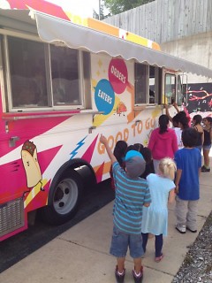 Cook Arts Center students line up outside the food truck with excitement