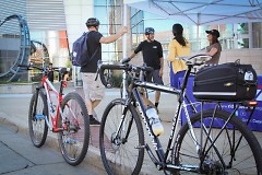 Bike to Work Day participants grabbing snacks and giveaway items at Rapid Central Station last year.