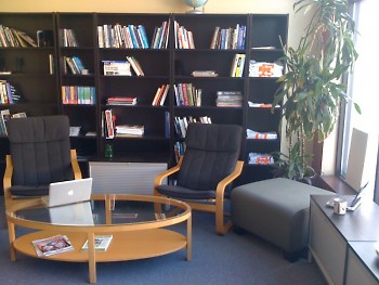 The newsroom is outfitted with comfy chairs, tea, and many resources to help you hone your reporting skills.