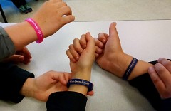 "Love is never love until you give it away": Students wear wristbands honoring Keegan Tarrant.