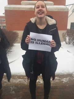 A student holding a sign in support of undocumented immigrants