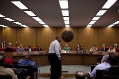 Concerned citizen addresses city commissioners on December 2 at City Hall