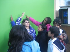 The GAAH Press Club in front of the green screen.