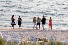 Guests taking a beach stroll at the first Summer Soiree.
