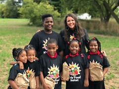 Students from Coit Creative Arts Academy and Kids Food Basket participants with Executive Director, Bridget Clark Whitney