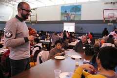 Ben Oliver, AmeriCorps ESL teacher, speaks with a family in the Schools of Hope Family Literacy Program.