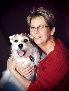 Mary Ullmer, with her Jack Russell terrier Stuart. Ullmer now is editor of a new magazine called Dogs Unleashed.