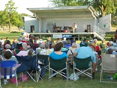 A view from behind the audience showing the Dueling Piano's performing their concert.