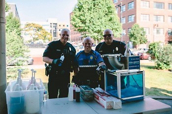 Community Officers Brian Grooms, Mike Sowle, and Rich Atha served snow-cones at National Night Out 2018
