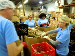 Companies both local and national volunteer at the Food Bank. These Nestle employees sorted potatoes in early October.