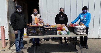 Grand Rapids Area Mutual Aid Network (GRAMAN) team distributing food to local families in need.