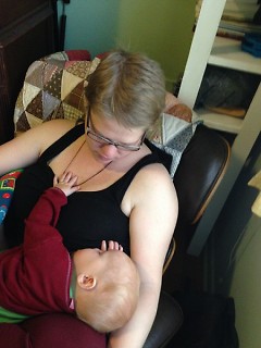 Author nursing child