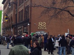 Protesters gather in front of 82 Ionia Ave.