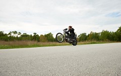 Rusty, riding a motorcycle on Drummond Island, MI.